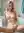 Slim nude body on bathtub edge
