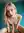 Hailey kneeling topless with tongue out