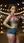Redhead in crop top shows midriff outdoors