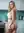 Kitchen counter over-shoulder lingerie pose