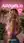 Blonde in pink crop top smiling back studio pose