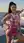 Asian gym girl in pink mini dress outdoors