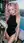 Pink pigtails rooftop bodysuit pose