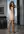 Redhead glances back in slip dress