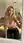 Blonde in pink sports bra kneeling mirror selfie yoga studio