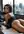 Brunette hazel eyes bent over desk