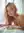 Young adult topless on white sheets