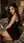 Young adult in bodycon dress on bed