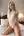 Blonde in sheer lace bodysuit on bed