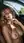 Curvy blonde topless in car