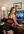 Redhead bends over office desk