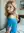 Slim blonde over-shoulder bedroom glance