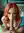 Nude redhead deepthroating on teal bed