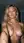 Topless blonde selfie in studio