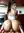 Jada in a tight white tee leaning against the kitchen counter at sunrise