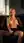 Topless on living room sofa