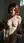 Nude redhead against washing machine