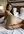 Curvy nude on bed looking back