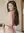 Curvy nude over-shoulder bedroom glance