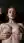 Redhead squeezes oiled tits close