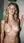 Nude blonde in shower spray