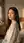 Over-the-shoulder glance in bedroom