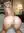 Young blonde nude on hotel bed