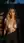 Nude blonde outdoor shower at dusk