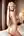 Blonde over-the-shoulder nude bedroom glance