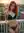 Redhead on sunny balcony