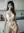 Young Asian barista in white lace