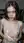 Slim brunette lifts sheer top