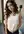 Curvy brunette lifts tank top