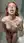 Redhead on knees tongue out in shower