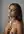 Topless brunette sits up in bed
