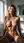Nude blonde straddles in sunlit bath