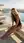 Rooftop poolside hands on knees