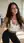 Brunette in crop top and leggings yoga studio glance