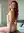 Redhead green eyes rides toy on bed