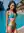 Slim brunette in turquoise bikini