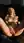Fingering on dark sofa