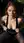 Redhead pulls tank top down garden bench