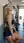 Sweaty blonde laughs in gym
