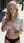 Curvy blonde lifts shirt on sidewalk