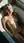 Blonde nude in sunlit bathtub