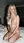 Nude blonde kneeling on hotel bed