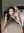 Topless Asian crawling on bedroom floor