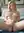 Young blonde spreads on bed