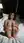 Young brunette soles up in hotel bed