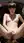 Slim brunette spreads on velvet chair